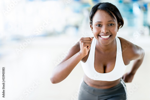 Photo: Competitive woman running Competitive woman running