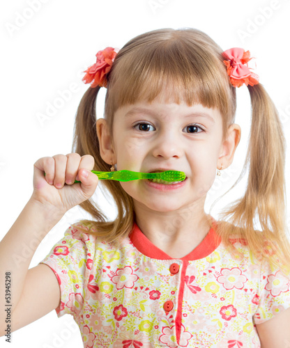 Photo: child girl cleaning teeth , isolated on white background child girl cleaning teeth , isolated on white background