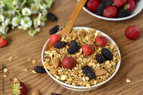 Photo: Healthy breakfast with granola and fresh berries Healthy breakfast with granola and fresh berries