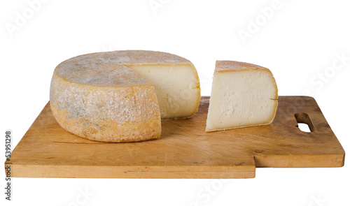 Photo: Traditional round farm cheese on wooden board Traditional round farm cheese on wooden board