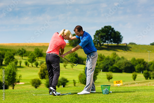 Photo: Young female golf player on course Young female golf player on course