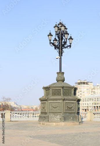 Photo: Ancient lantern on the background of the Moscow Kremlin. Ancient lantern on the background of the Moscow Kremlin.