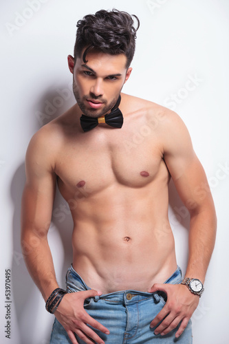 Photo: topless young man pulls dow his pants topless young man pulls dow his pants