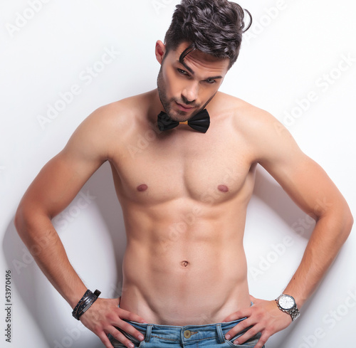 Photo: topless young man with hands on hips topless young man with hands on hips