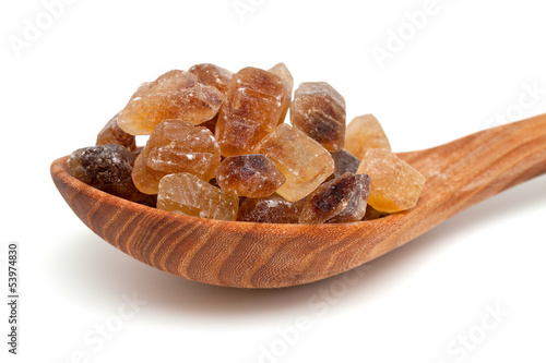 Photo: brown caramelized sugar on white background brown caramelized sugar on white background