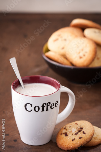 Photo: Cup of coffee with two homemade cookies Cup of coffee with two homemade cookies
