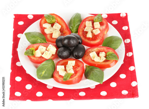 Photo: Cheese mozzarella with vegetables in the plate isolated on Cheese mozzarella with vegetables in the plate isolated on