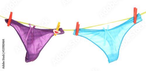 Photo: Women's panties hanging on rope isolated on white Women's panties hanging on rope isolated on white
