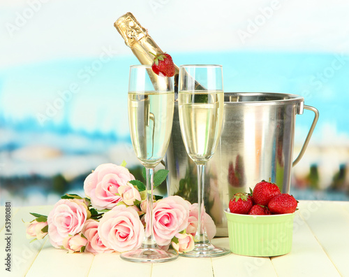 Photo: Romantic still life with champagne, strawberry and pink roses, Romantic still life with champagne, strawberry and pink roses,