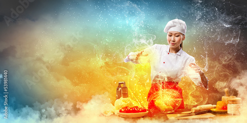 Photo: Asian female cooking with magic Asian female cooking with magic