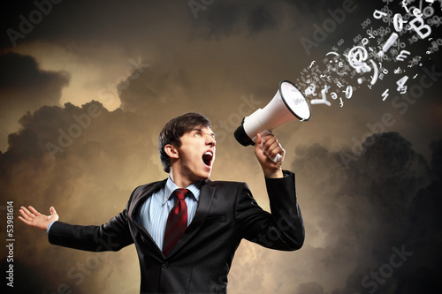 Photo: businessman with megaphone businessman with megaphone