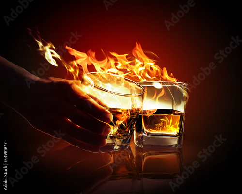 Photo: Two glasses of burning yellow absinthe Two glasses of burning yellow absinthe