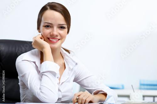 Photo: Young businesswoman in the office Young businesswoman in the office