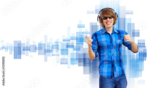 Photo: Happy smiling young man dancing Happy smiling young man dancing