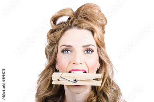 Photo: Comical pinup girl with big laundry peg in mouth Comical pinup girl with big laundry peg in mouth