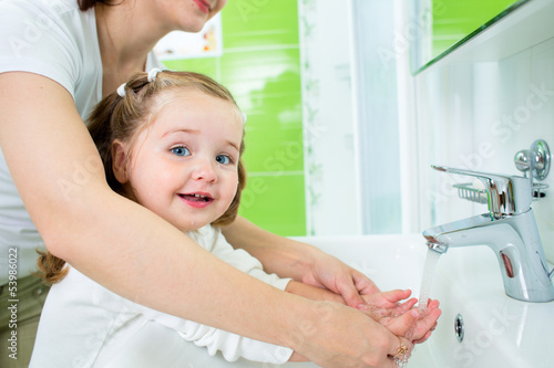 Photo: mother washing baby hands mother washing baby hands