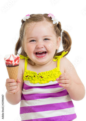 Photo: happy kid girl eating ice-cream in studio isolated happy kid girl eating ice-cream in studio isolated