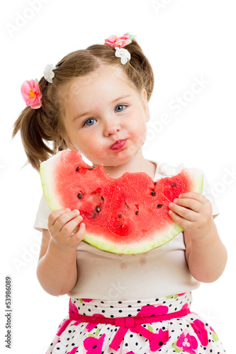 Photo: kid girl eating watermelon isolated on white background kid girl eating watermelon isolated on white background