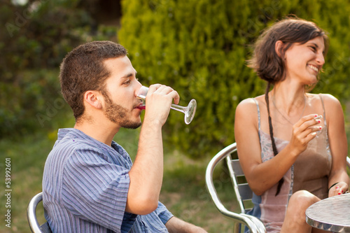 Photo: Couple of friends drinking sangria outdoors Couple of friends drinking sangria outdoors