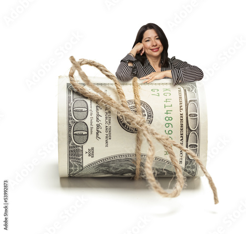 Photo: Hispanic Woman Leaning on a Roll Of Hundred Dollar Bills Hispanic Woman Leaning on a Roll Of Hundred Dollar Bills