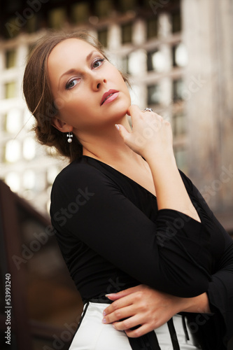 Photo: Sad beautiful woman daydreaming Sad beautiful woman daydreaming