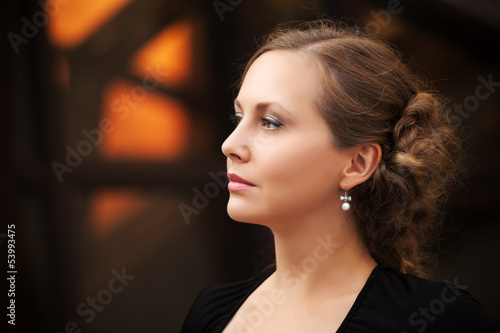 Photo: Beautiful woman walking on the city street Beautiful woman walking on the city street