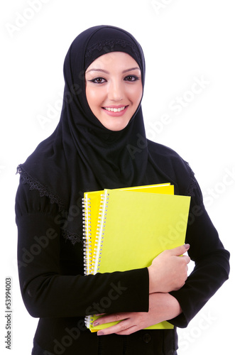 Photo: Young muslim woman with book on white Young muslim woman with book on white
