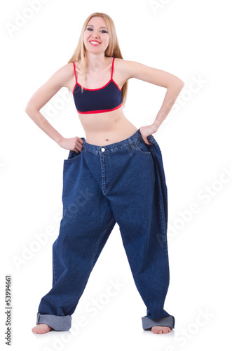 Photo: Dieting concept with oversize jeans Dieting concept with oversize jeans