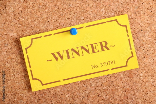 Photo: Winner Ticket on a cork notice board Winner Ticket on a cork notice board