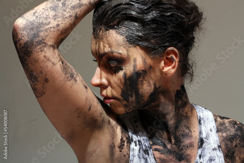 Photo: woman covered in mud woman covered in mud
