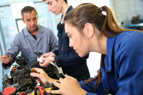 Photo: Mechanics training class with teacher and students Mechanics training class with teacher and students