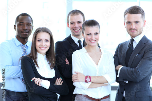 Photo: Group portrait of a professional business team looking at camera Group portrait of a professional business team looking at camera