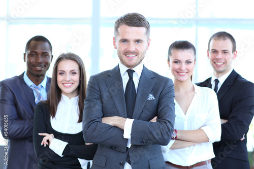 Photo: Group portrait of a professional business team looking at camera Group portrait of a professional business team looking at camera