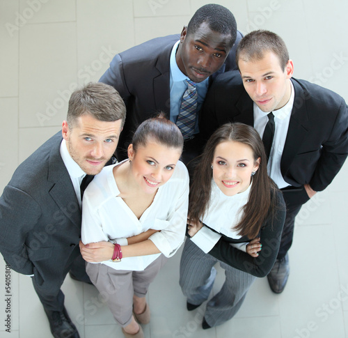 Photo: Closeup portrait of a successful business team laughing together Closeup portrait of a successful business team laughing together