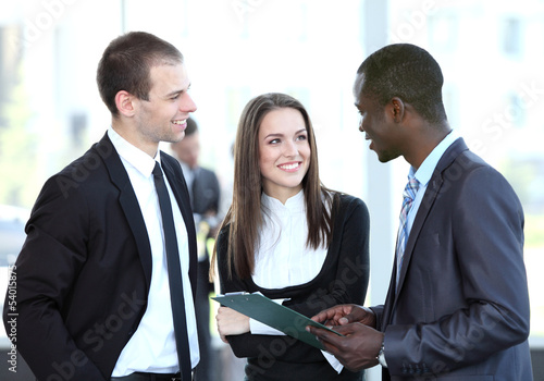 Photo: Image of business partners discussing documents and ideas Image of business partners discussing documents and ideas