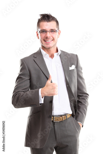 Photo: Happy smiling young business man with thumbs up gesture Happy smiling young business man with thumbs up gesture