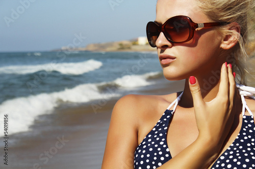 Photo: Beautiful blond woman on the beach Beautiful blond woman on the beach