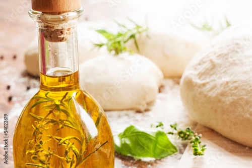 Photo: olive oil , herbs and fresh homemade pizza dough olive oil , herbs and fresh homemade pizza dough