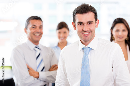 Photo: Business man with his team Business man with his team