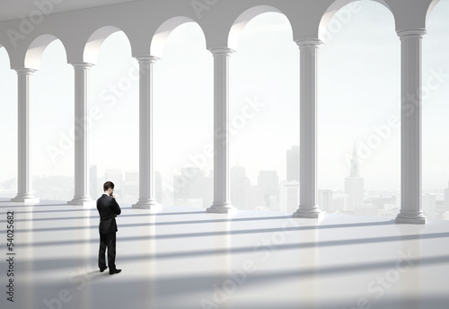 Photo: thinking businessman in hall thinking businessman in hall