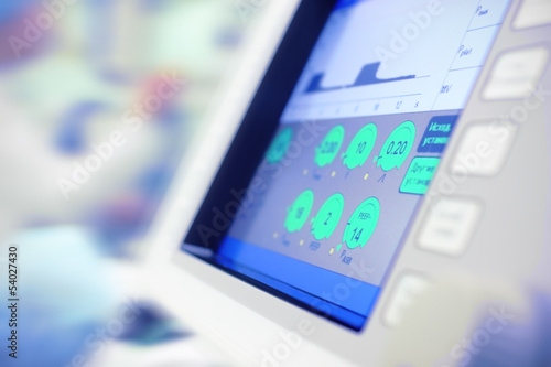 Photo: modern monitor of scientific device in hospital use. modern monitor of scientific device in hospital use.