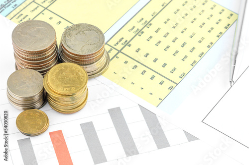 Photo: Coins with busniess graph Coins with busniess graph