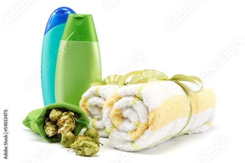 Photo: Spa or bathroom concept with towels, soaps and hops. Spa or bathroom concept with towels, soaps and hops.