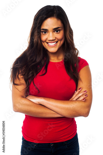 Photo: Young smiling woman, arms crossed Young smiling woman, arms crossed
