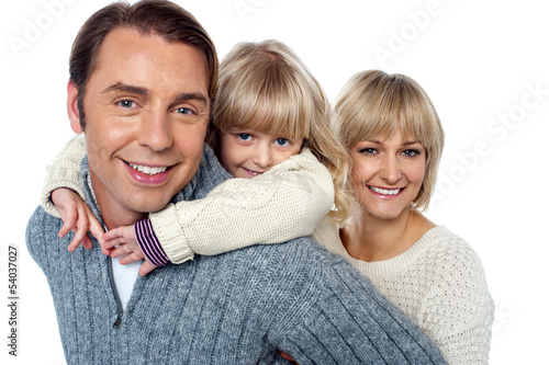 Photo: Father giving daughter a piggyback ride Father giving daughter a piggyback ride