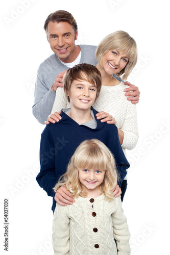Photo: Family of four posing in a row Family of four posing in a row