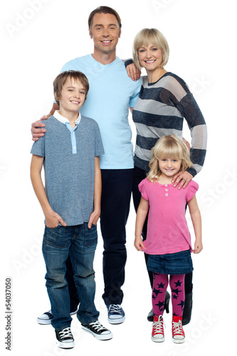 Photo: Smiling young couple with their children Smiling young couple with their children