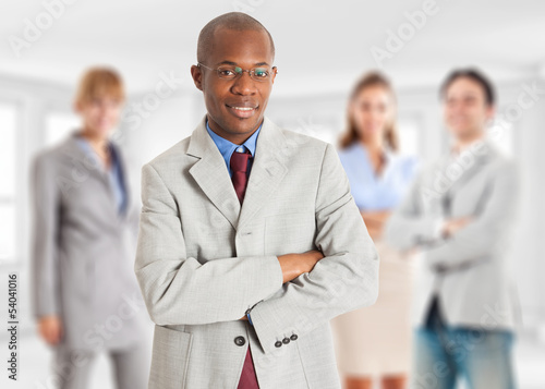 Photo: Young leader in front of his team Young leader in front of his team