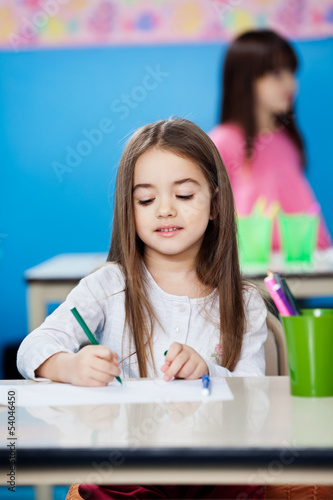Photo: Girl Drawing With Sketch Pen In Preschool Girl Drawing With Sketch Pen In Preschool
