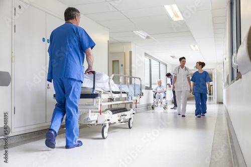 Photo: Doctors Hospital Corridor Nurse Pushing Gurney Stretcher Bed Doctors Hospital Corridor Nurse Pushing Gurney Stretcher Bed